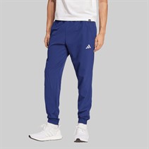 adidas Spodnie dresowe plecione dla niego kolor Dark Blue