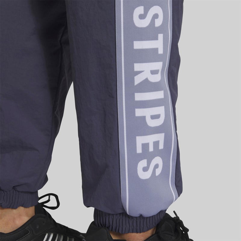 adidas Spodnie dresowe o luźnym kroju z napisem dla niego kolor Shadow Navy