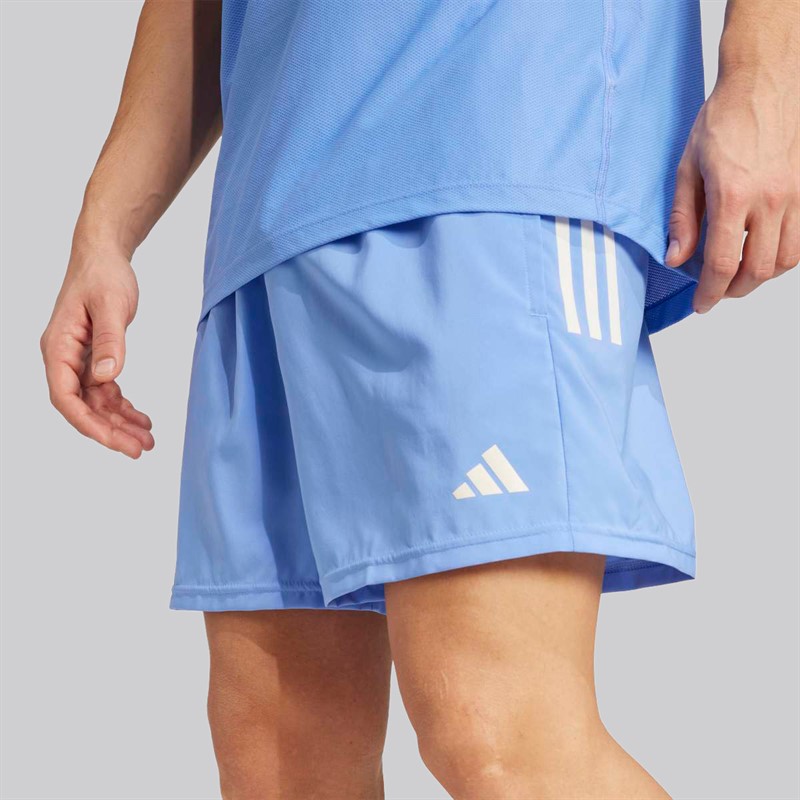adidas Spodnie do biegania Own The Run dla niego kolor Blue Fushion
