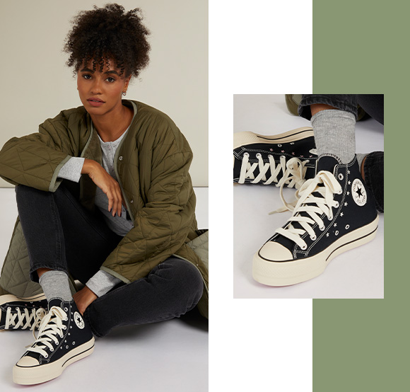 Quilted UGG jacket and Converse trainers.