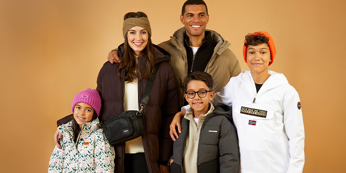 Young family wearing warm clothing.