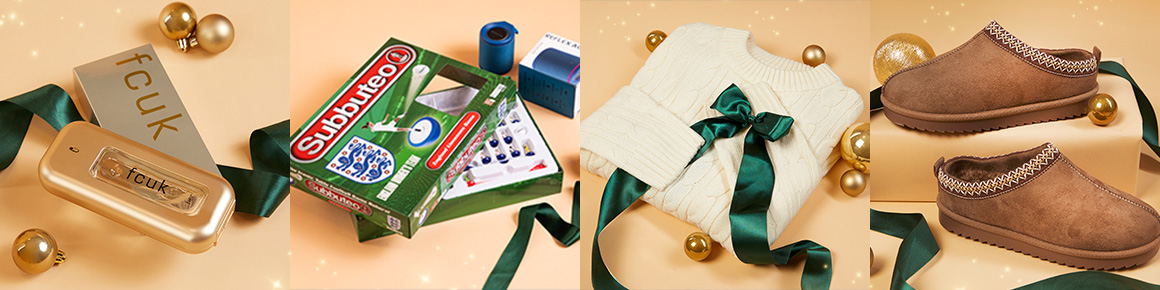 Festive gift ideas photographed on a table with green ribbon and baubles.