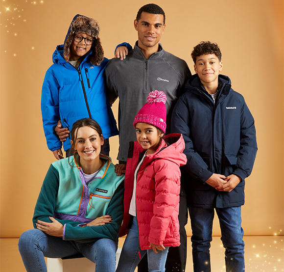 Family wearing winter coats and hats.